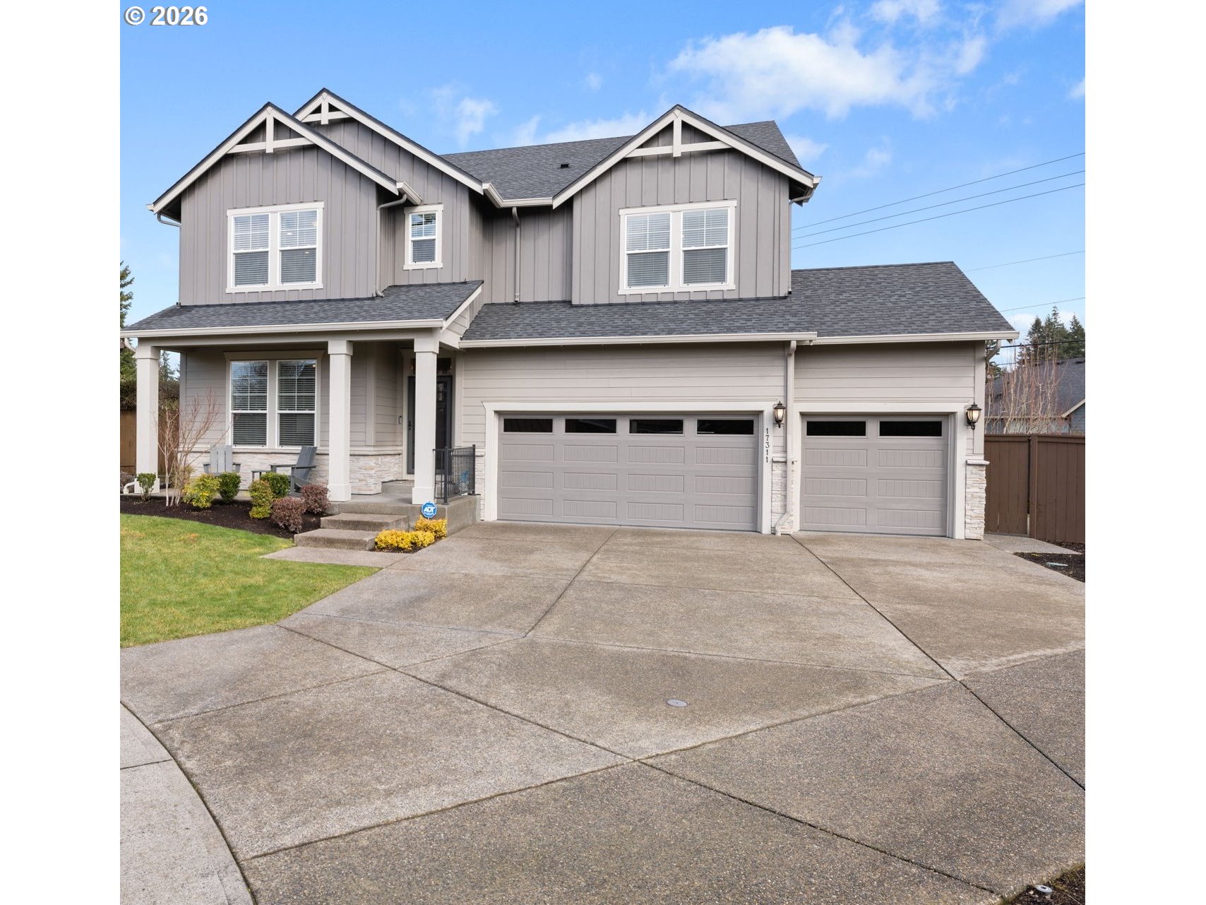 17311 Northeast 28th Court Ridgefield, WA 98642 - Photo 38 of 38 a front view of a house with a yard and garage