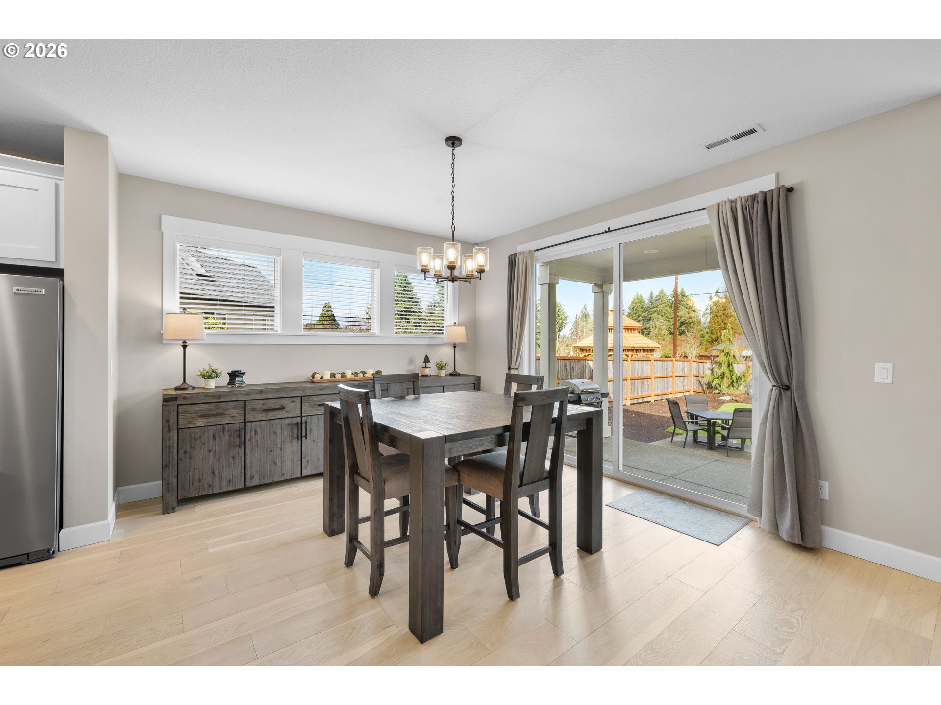 17311 Northeast 28th Court Ridgefield, WA 98642 - Photo 10 of 38 a kitchen with stainless steel appliances granite countertop a stove a sink dishwasher and a dining table with kitchen view