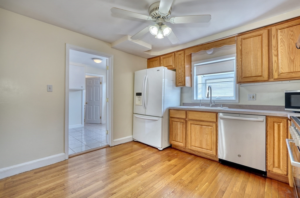 173 Overlook Road Arlington, MA 02474 - Photo 11 of 42 a kitchen with stainless steel appliances a refrigerator and a stove top oven