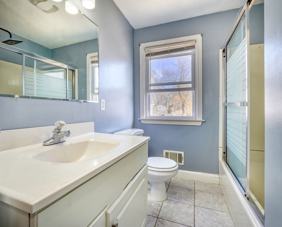 173 Overlook Road Arlington, MA 02474 - Photo 14 of 42 a bathroom with a sink toilet and a mirror