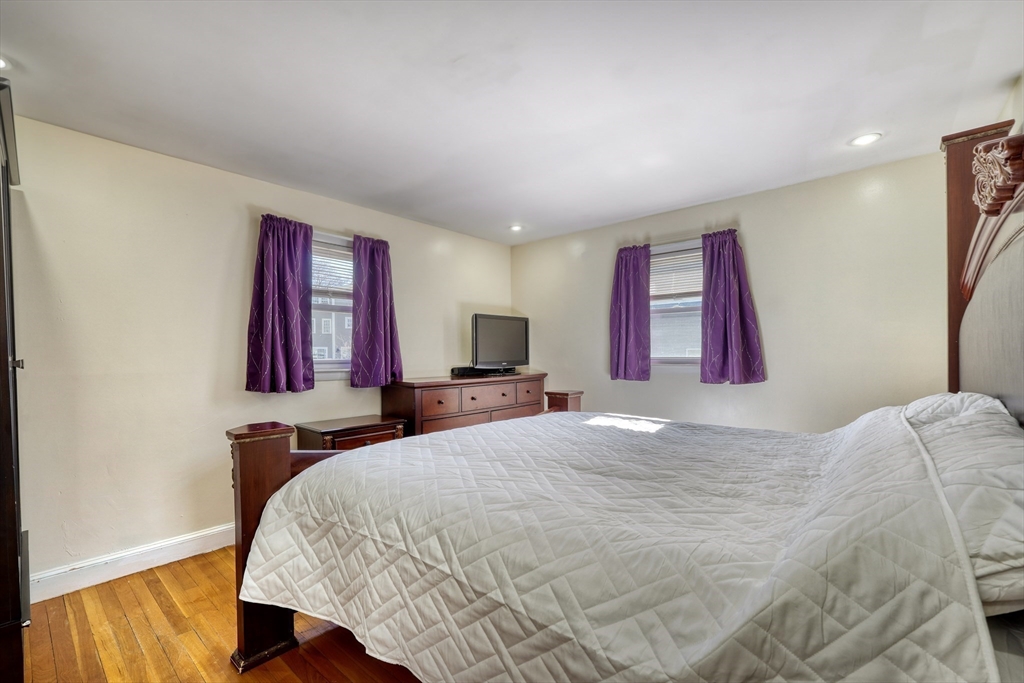 173 Overlook Road Arlington, MA 02474 - Photo 16 of 42 a bedroom with a bed and a dresser