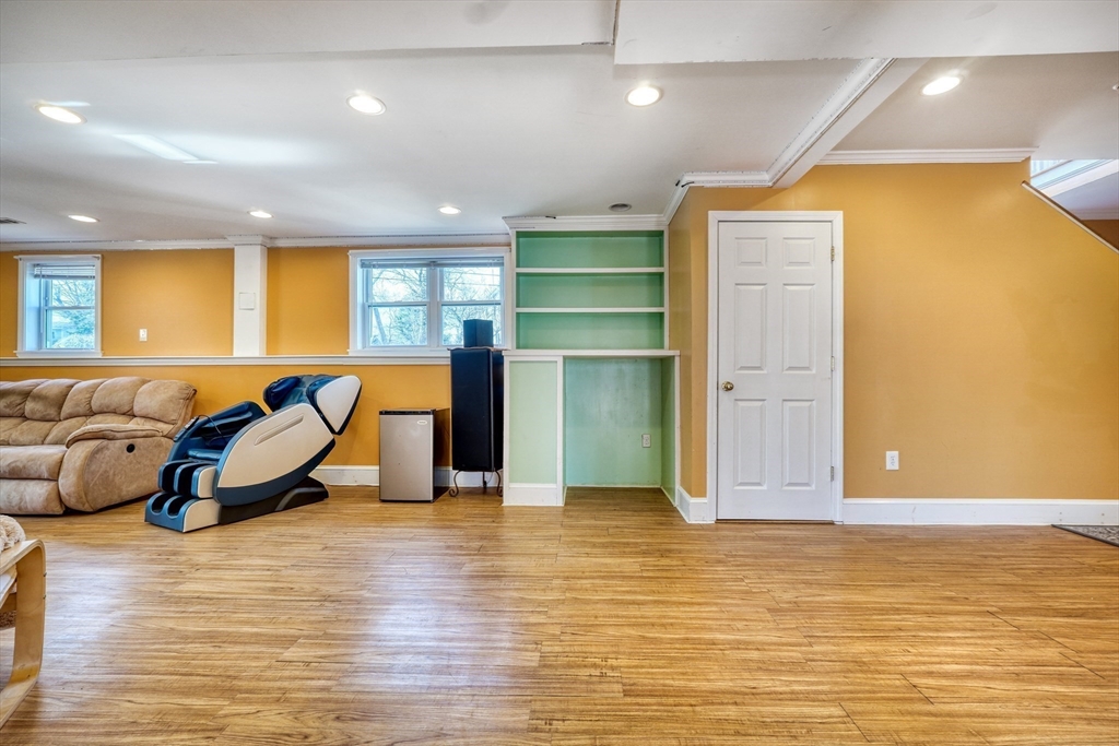 173 Overlook Road Arlington, MA 02474 - Photo 21 of 42 a room with wooden floor and furniture