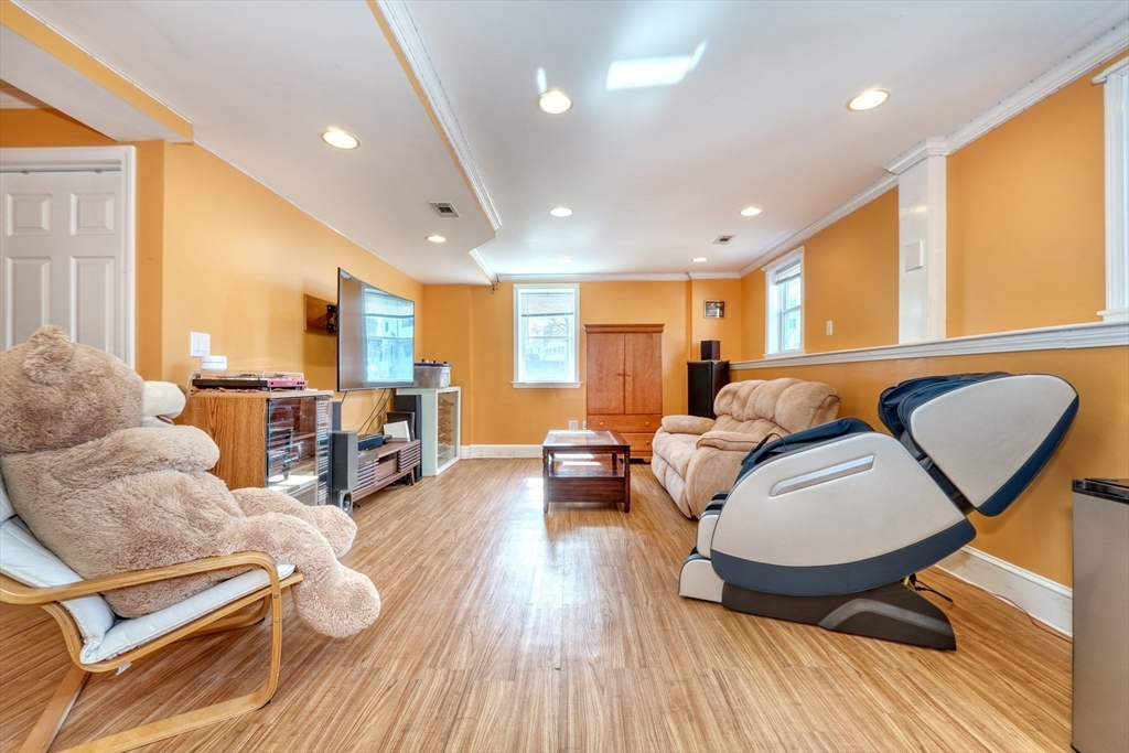 173 Overlook Road Arlington, MA 02474 - Photo 22 of 42 a living room with furniture and wooden floor