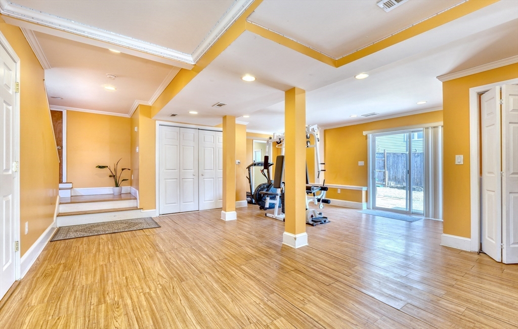 173 Overlook Road Arlington, MA 02474 - Photo 25 of 42 a view of a hallway with wooden floor and a bathroom