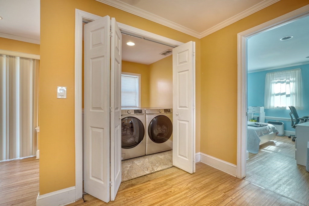 173 Overlook Road Arlington, MA 02474 - Photo 27 of 42 a view of a hallway with washer and dryer