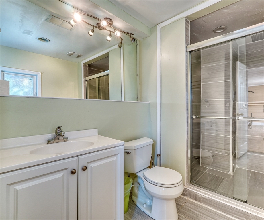 173 Overlook Road Arlington, MA 02474 - Photo 28 of 42 a bathroom with a sink toilet and shower