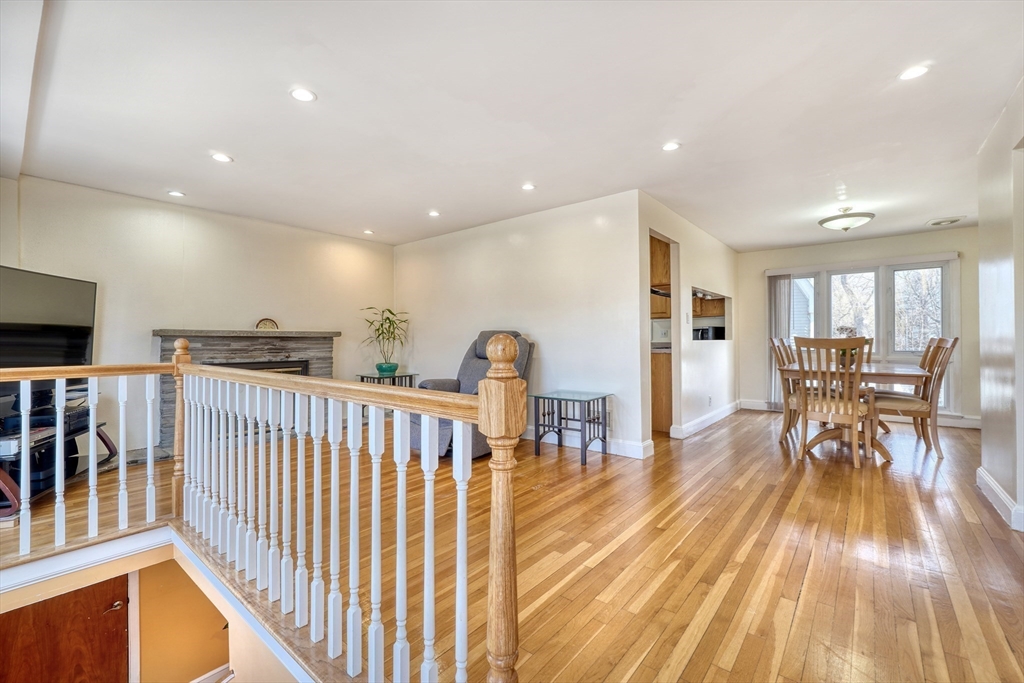 173 Overlook Road Arlington, MA 02474 - Photo 3 of 42 a view of a dining room with furniture and wooden floor
