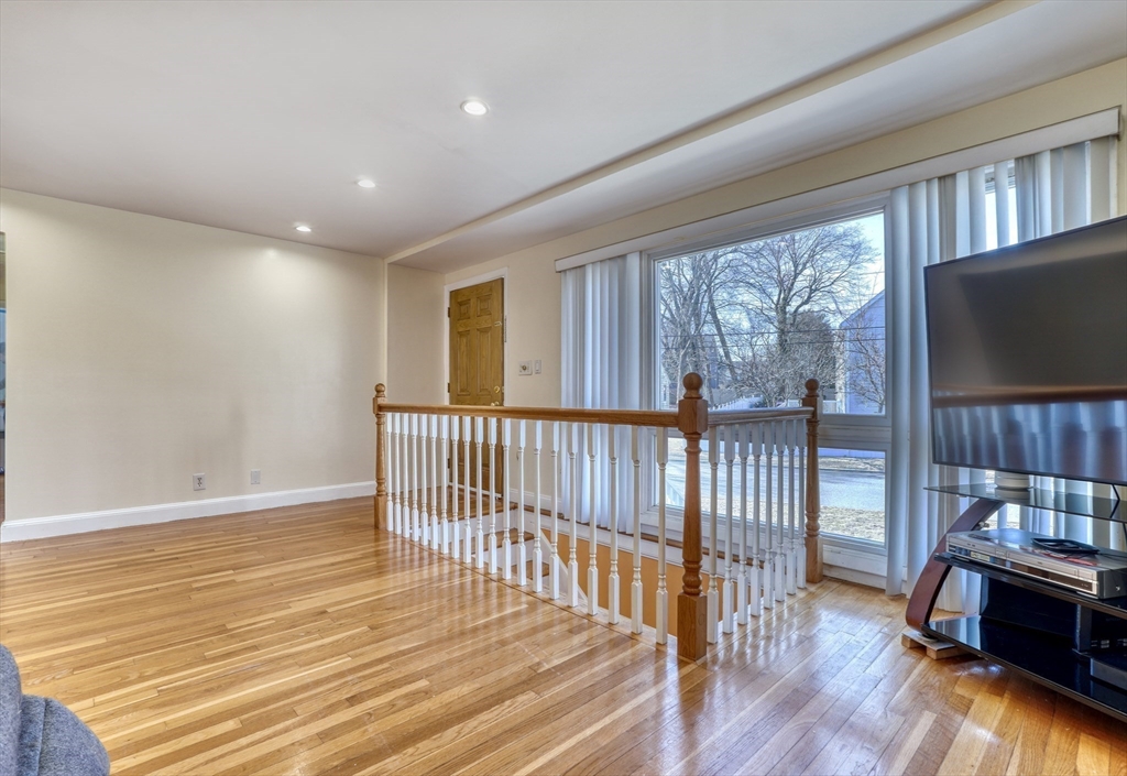 173 Overlook Road Arlington, MA 02474 - Photo 6 of 42 a view of livingroom with furniture wooden floor and window