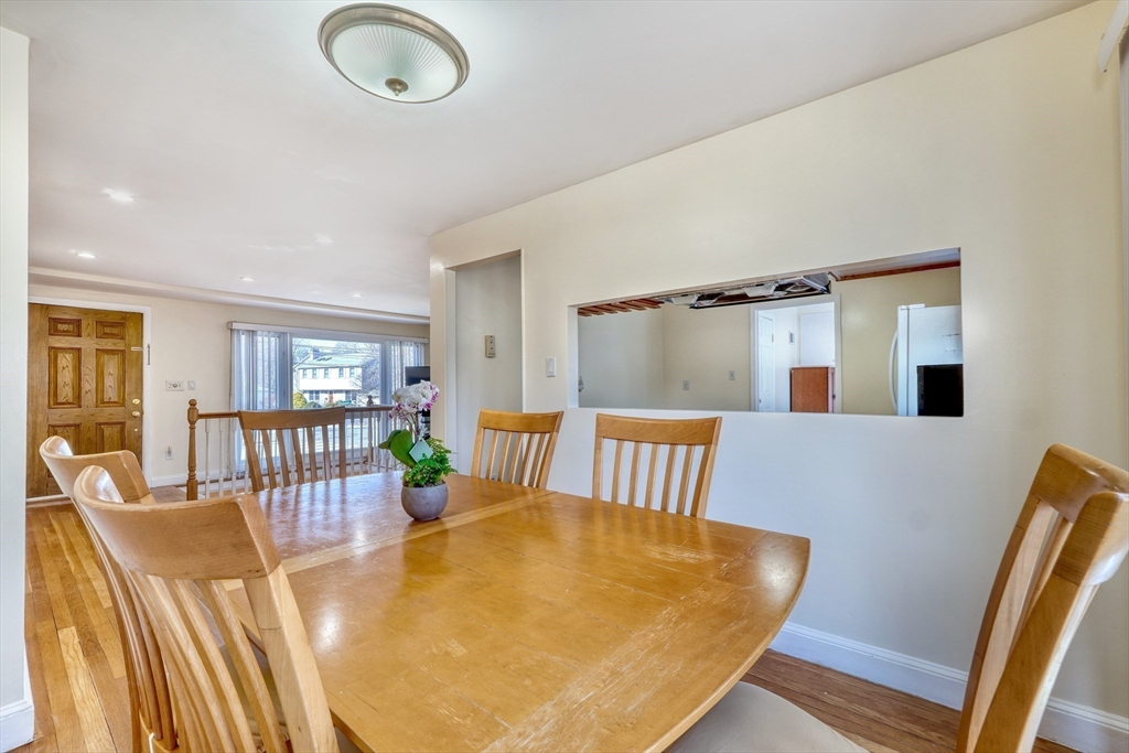 173 Overlook Road Arlington, MA 02474 - Photo 8 of 42 a view of a dining room with furniture and wooden floor