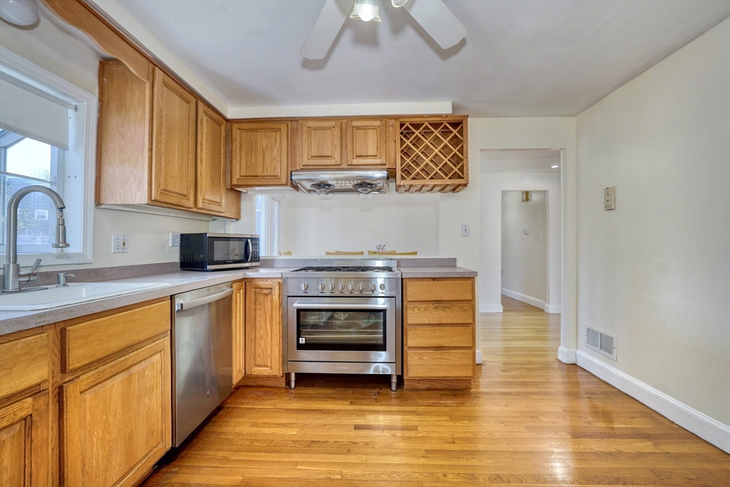 173 Overlook Road Arlington, MA 02474 - Photo 10 of 42 a kitchen with stainless steel appliances granite countertop a stove and a sink