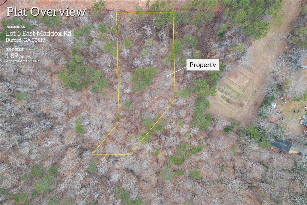 2350 East Maddox Road Buford, GA 30519 - Photo 2 of 17 a sign that is on a brick wall