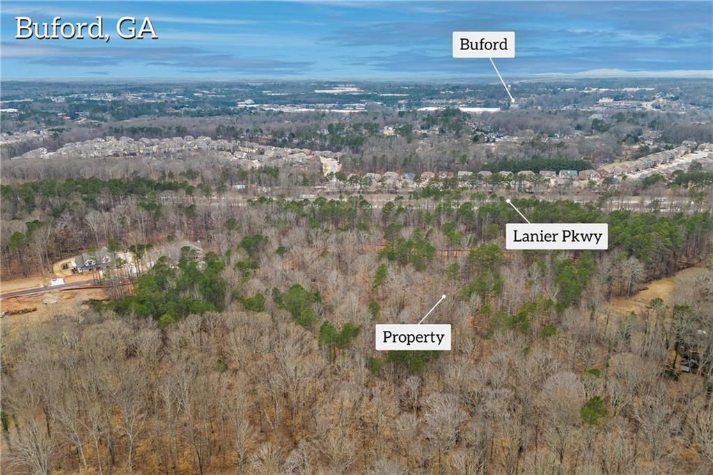 2350 East Maddox Road Buford, GA 30519 - Photo 7 of 17 a view of a street with a bench and trees in the background