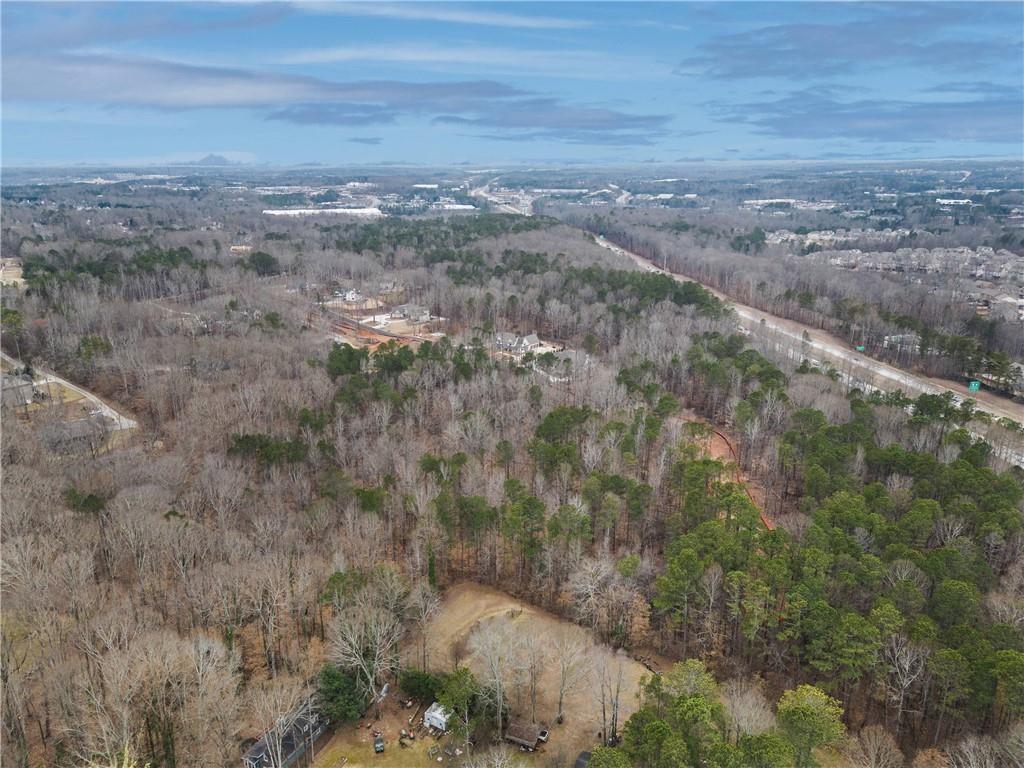 2350 East Maddox Road Buford, GA 30519 - Photo 8 of 17 a view of a big yard with lots of green space