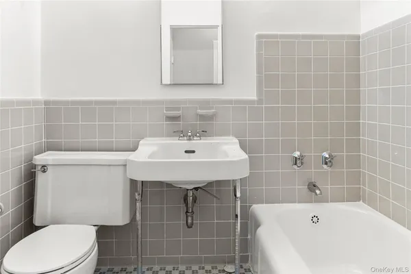 a bathroom with a sink toilet and bathtub