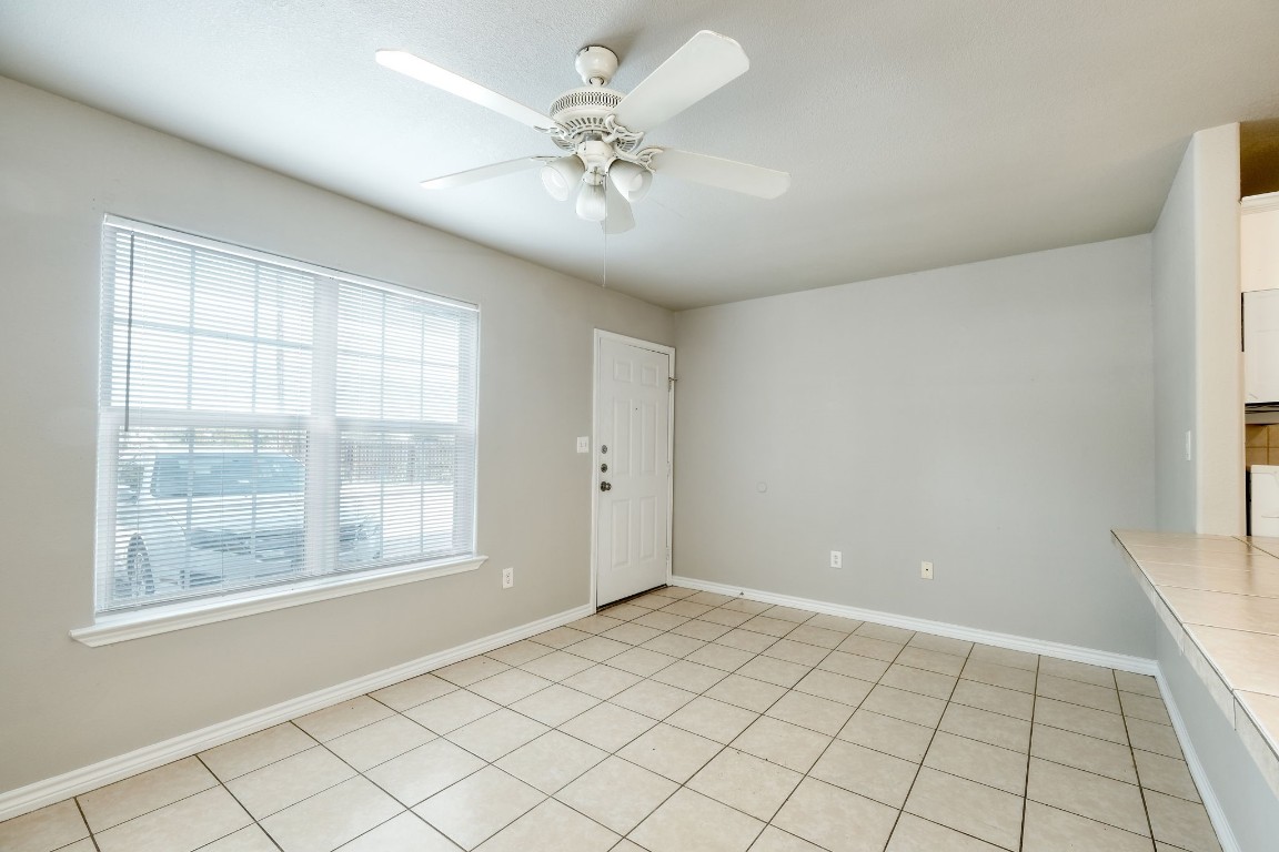 107 Castleberry Court, Unit C Bertram, TX 78605 - Photo 4 of 14 a view of an empty room with a window