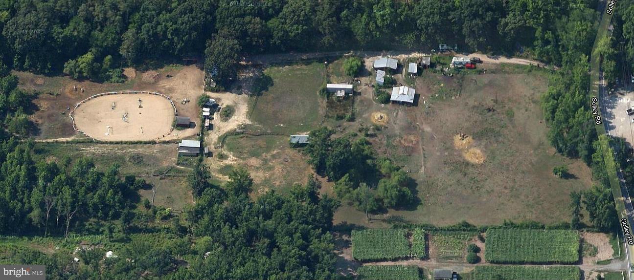 7917 Solley Road Glen Burnie, MD 21060 - Photo 2 of 2 an aerial view of a house with a yard and lake view