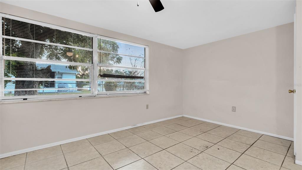11241 Snyder Avenue Port Richey, FL 34668 - Photo 15 of 24 a view of an empty room with a window