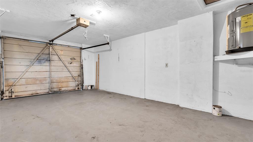 11241 Snyder Avenue Port Richey, FL 34668 - Photo 22 of 24 a view of a room with storage and utility