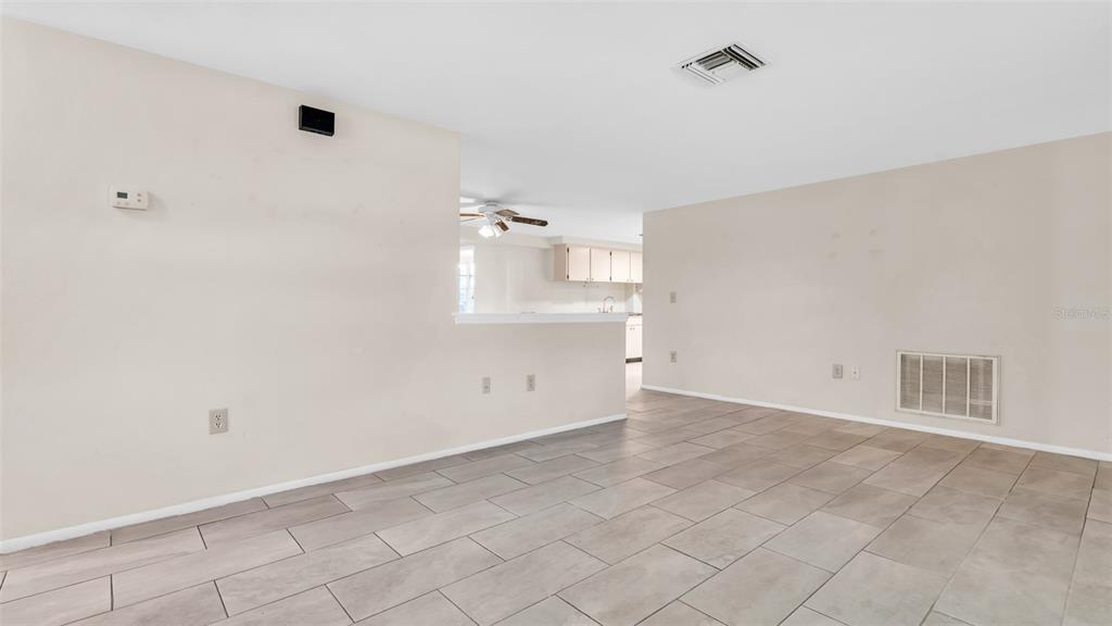 11241 Snyder Avenue Port Richey, FL 34668 - Photo 6 of 24 wooden floor in an empty room