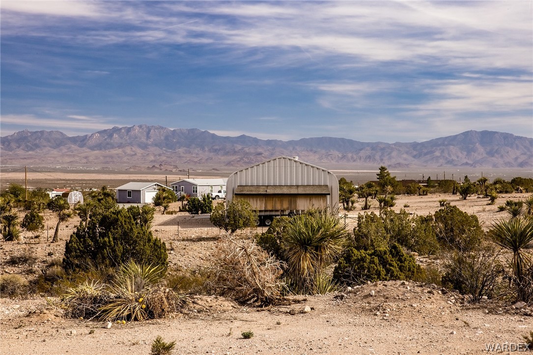2310 Dewey Road Golden Valley, AZ 86413 - Photo 46 of 76 a view of a town with mountains in the background