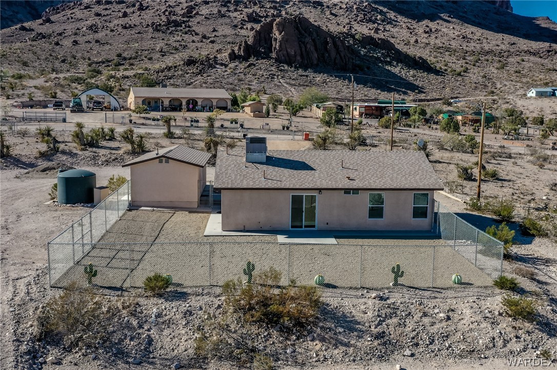 2310 Dewey Road Golden Valley, AZ 86413 - Photo 68 of 76 a view of a house with a yard