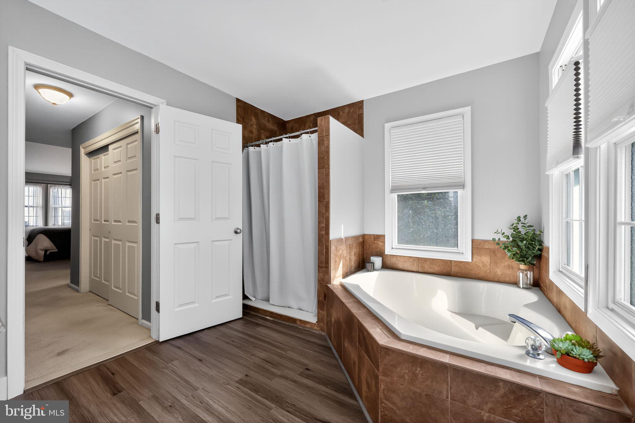 27 Southampton Parish Road Landenberg, PA 19350 - Photo 20 of 34 a bathroom with a tub a mirror and a shower