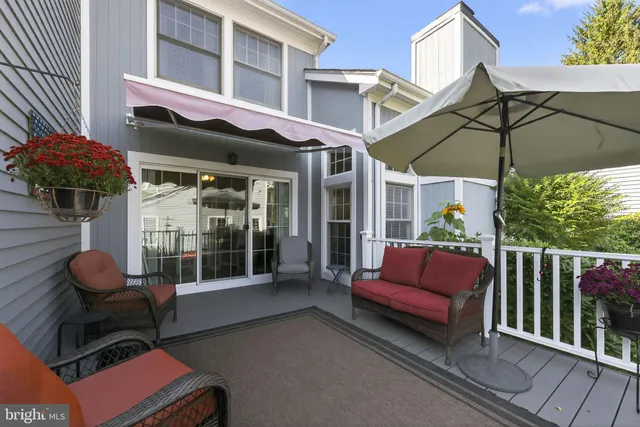 a view of a chairs and table in the patio