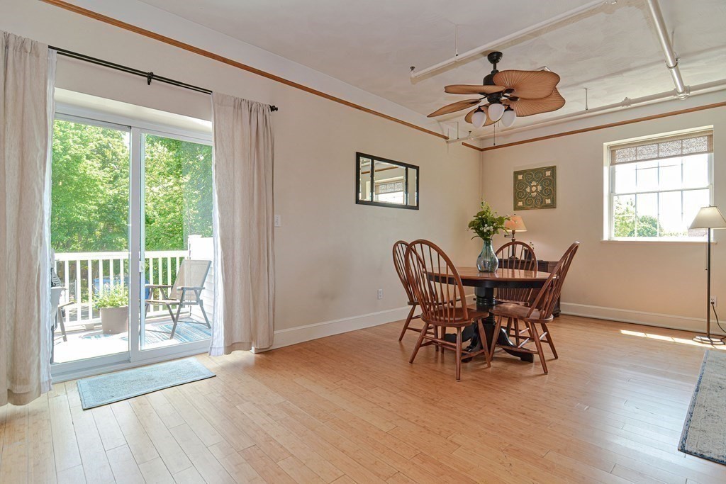 200 Cato Street, Unit 7 Woonsocket, RI 02895 - Photo 11 of 39 a view of a dining room with furniture window and wooden floor