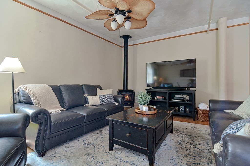 200 Cato Street, Unit 7 Woonsocket, RI 02895 - Photo 14 of 39 a living room with furniture and a flat screen tv