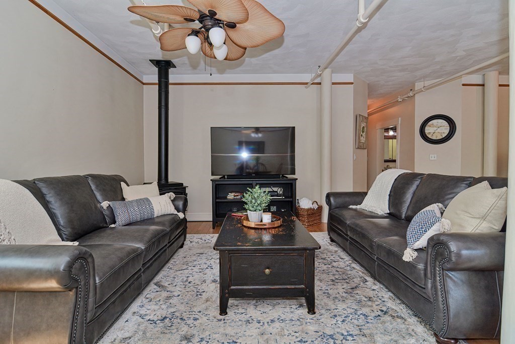 200 Cato Street, Unit 7 Woonsocket, RI 02895 - Photo 15 of 39 a living room with furniture and a flat screen tv