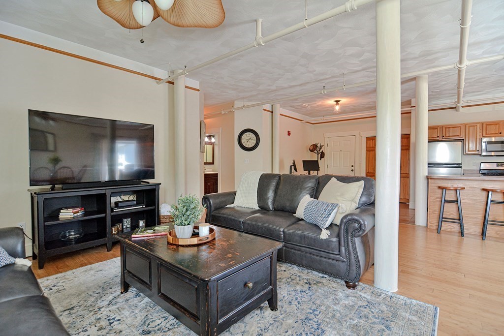 200 Cato Street, Unit 7 Woonsocket, RI 02895 - Photo 16 of 39 a living room with furniture and a flat screen tv