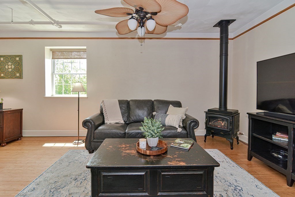 200 Cato Street, Unit 7 Woonsocket, RI 02895 - Photo 17 of 39 a living room with furniture and flat screen tv