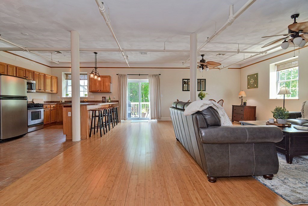 200 Cato Street, Unit 7 Woonsocket, RI 02895 - Photo 20 of 39 a living room with furniture and a wooden floor