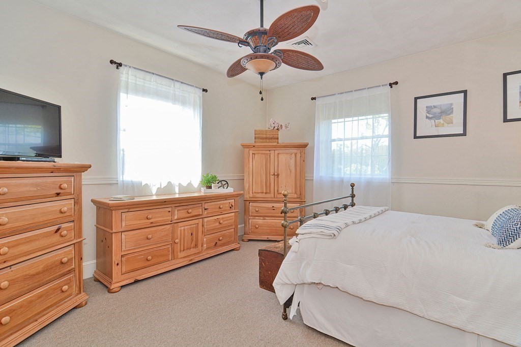 200 Cato Street, Unit 7 Woonsocket, RI 02895 - Photo 24 of 39 a bedroom with a bed and a dresser