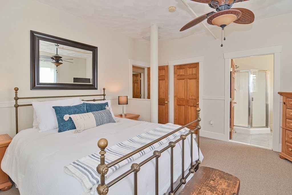 200 Cato Street, Unit 7 Woonsocket, RI 02895 - Photo 27 of 39 a bedroom with a bed and a chandelier