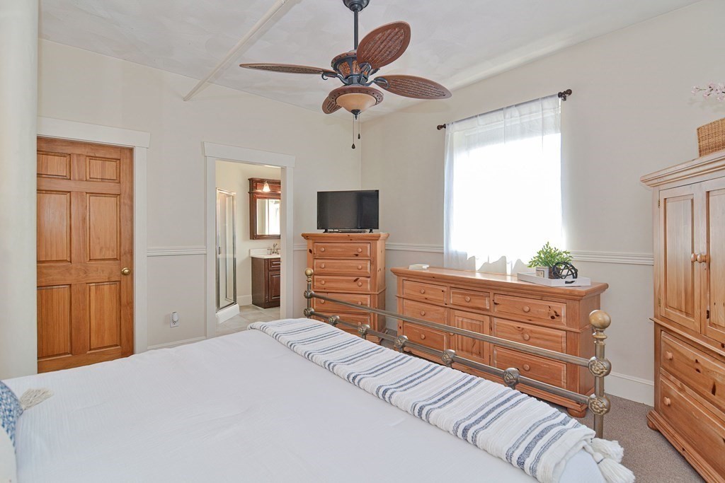 200 Cato Street, Unit 7 Woonsocket, RI 02895 - Photo 28 of 39 a bedroom with a bed and a dresser