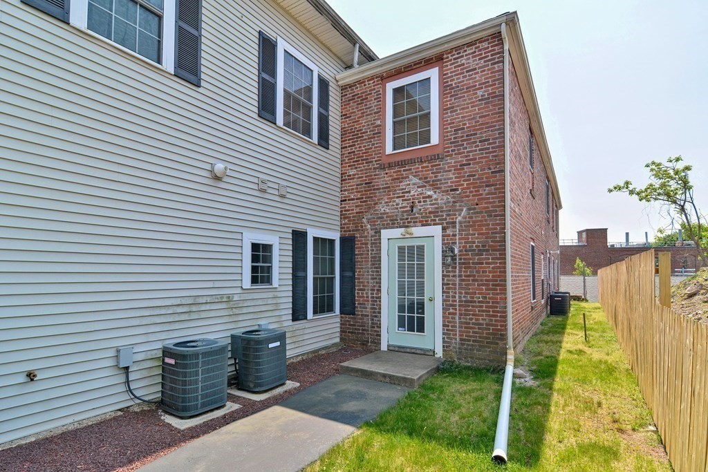 200 Cato Street, Unit 7 Woonsocket, RI 02895 - Photo 36 of 39 a front view of a house with a yard