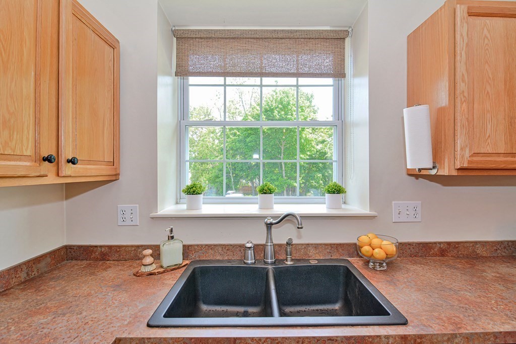 200 Cato Street, Unit 7 Woonsocket, RI 02895 - Photo 4 of 39 a kitchen that has a sink and a window
