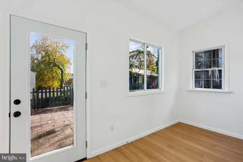 a bedroom with a bed and painting on the wall