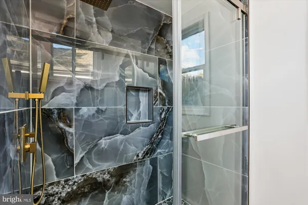 a bathroom with a sink a toilet and a bathtub