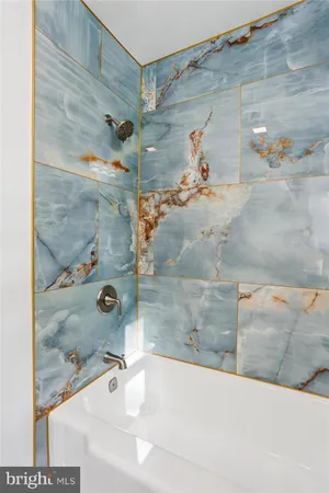 a bathroom with a sink mirror and toilet