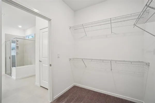 a bathroom with a double vanity sink a mirror and a shower