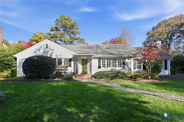 a front view of a house with a yard and porch