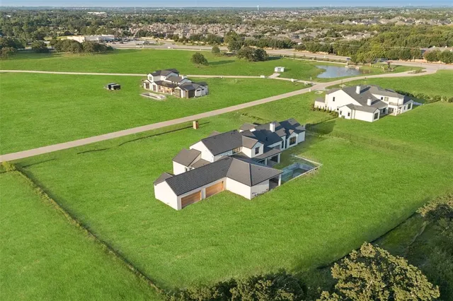 an aerial view of a house with a garden