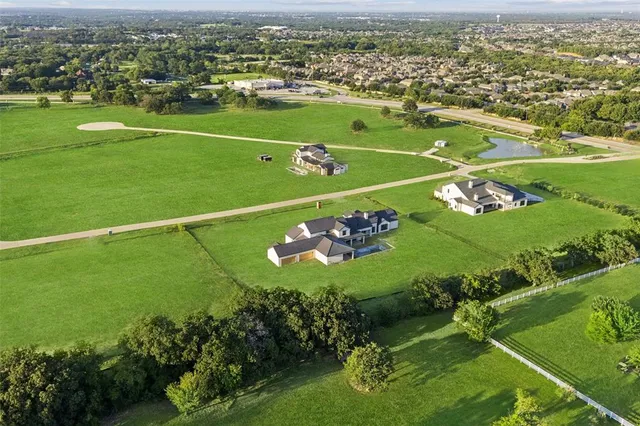 a view of a golf course with a field