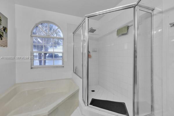 14817 Balgowan Road, Unit 2015 Miami Lakes, FL 33016 - Photo 13 of 39 a bathroom with a glass shower door and a window