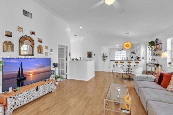 14817 Balgowan Road, Unit 2015 Miami Lakes, FL 33016 - Photo 16 of 39 a living room with furniture and a fireplace