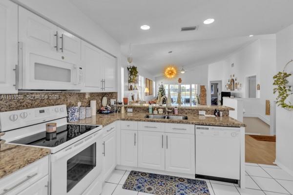 14817 Balgowan Road, Unit 2015 Miami Lakes, FL 33016 - Photo 20 of 39 a kitchen with stainless steel appliances granite countertop a sink and cabinets