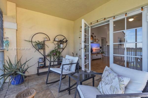 14817 Balgowan Road, Unit 2015 Miami Lakes, FL 33016 - Photo 23 of 39 a living room with furniture