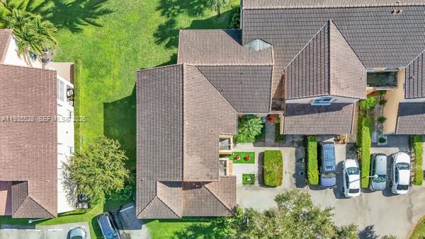 14817 Balgowan Road, Unit 2015 Miami Lakes, FL 33016 - Photo 28 of 39 front view of a house with a garden